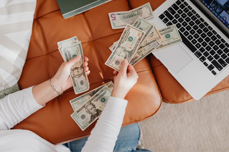 Money in front of a computer